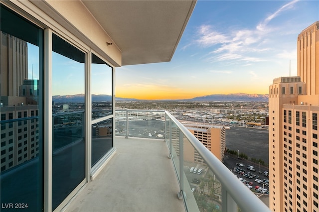 balcony with a view of city and a mountain view