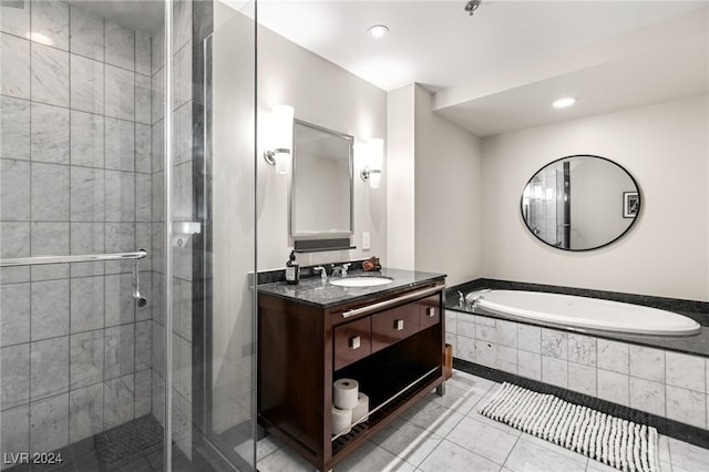 full bathroom featuring recessed lighting, a shower stall, tile patterned flooring, a bath, and vanity