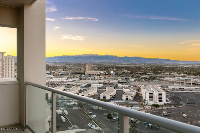 balcony with a mountain view and a city view