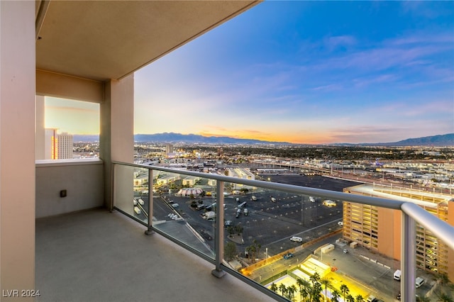 balcony with a mountain view and a city view