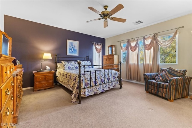 bedroom featuring ceiling fan and light colored carpet