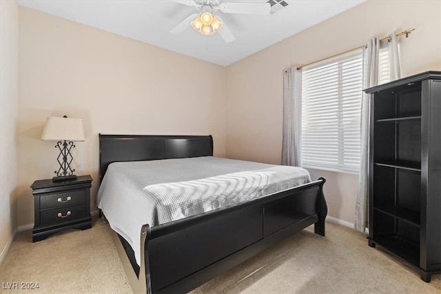 bedroom featuring ceiling fan and light colored carpet