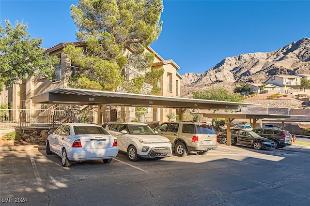 view of vehicle parking with a mountain view