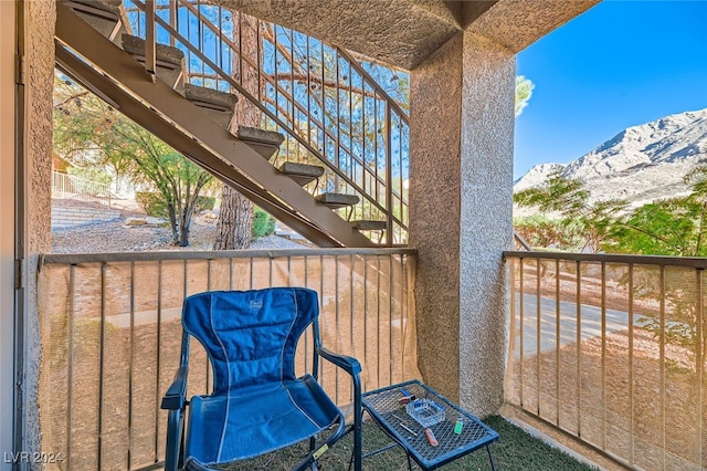 balcony featuring a mountain view