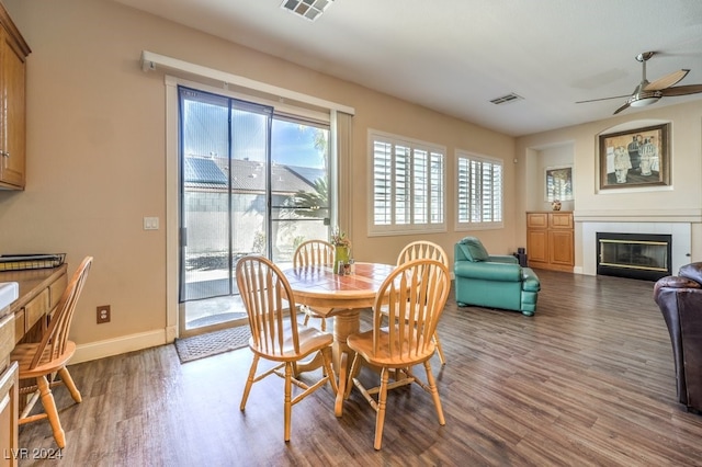 dining space featuring hardwood / wood-style floors and ceiling fan