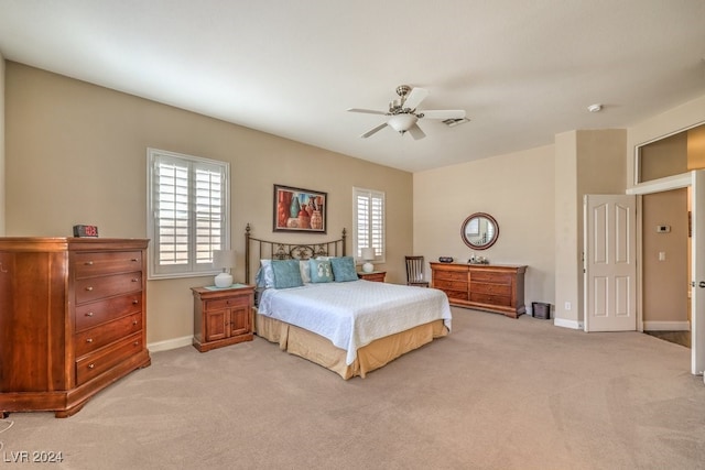 bedroom featuring ceiling fan and light carpet