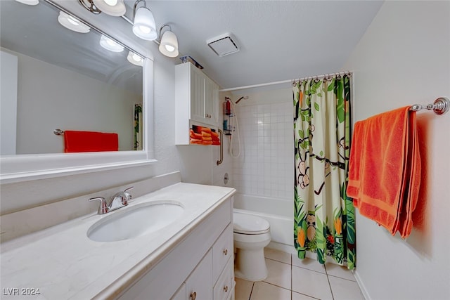 full bathroom featuring vanity, shower / tub combo with curtain, tile patterned floors, and toilet