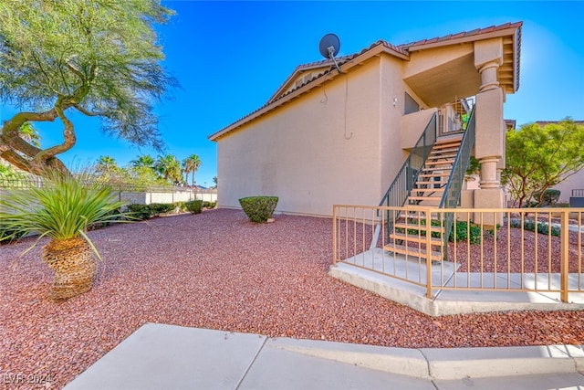 view of side of home featuring a patio