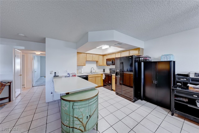 kitchen featuring light tile patterned flooring, sink, black appliances, kitchen peninsula, and light brown cabinetry