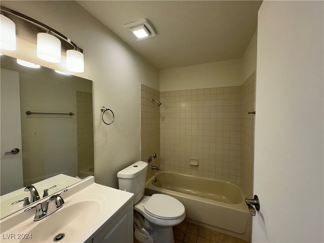 full bathroom with a textured ceiling, vanity, tile patterned floors, toilet, and tiled shower / bath combo