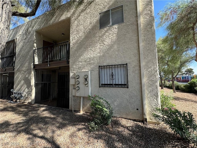 4464 W Desert Inn Rd Unit A, Las Vegas, NV 89102 - rear view of house with stucco siding