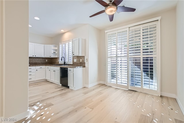 kitchen featuring white cabinetry, backsplash, light wood-type flooring, sink, and dishwasher