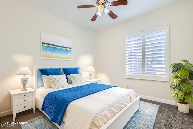 bedroom featuring ceiling fan and dark colored carpet