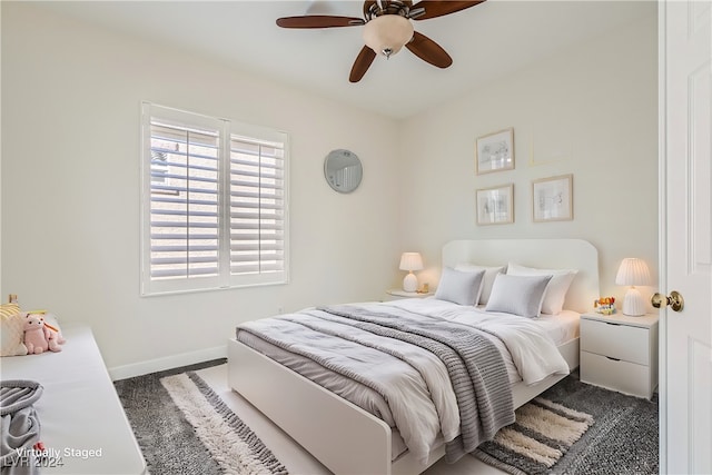 carpeted bedroom with ceiling fan