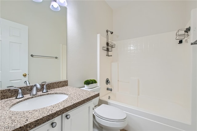 full bathroom featuring toilet, vanity, and  shower combination