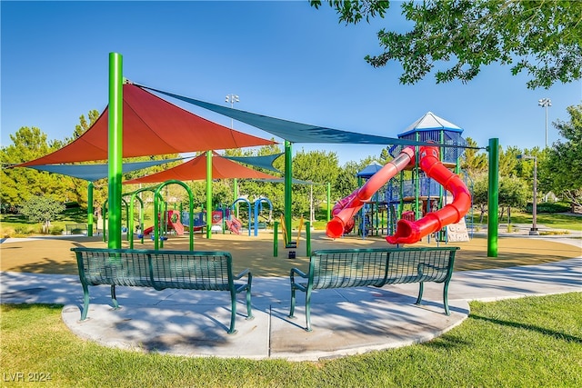 surrounding community with a lawn and a playground