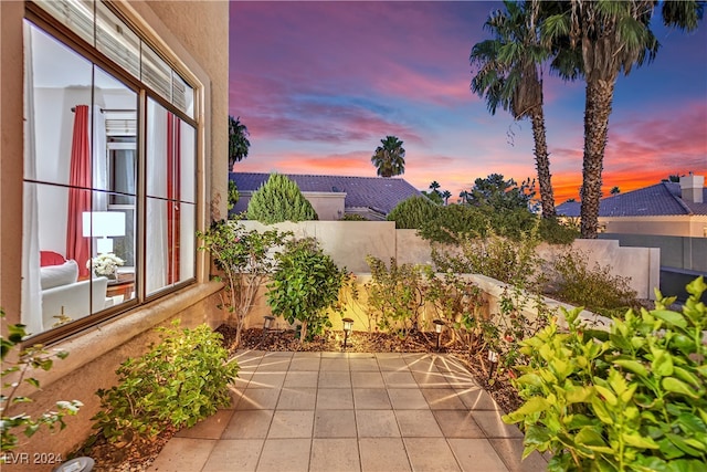 view of patio terrace at dusk