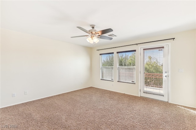 empty room featuring carpet flooring and ceiling fan