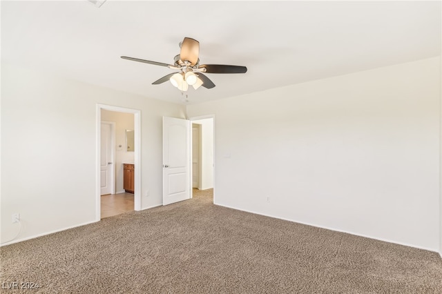 empty room with carpet flooring and ceiling fan