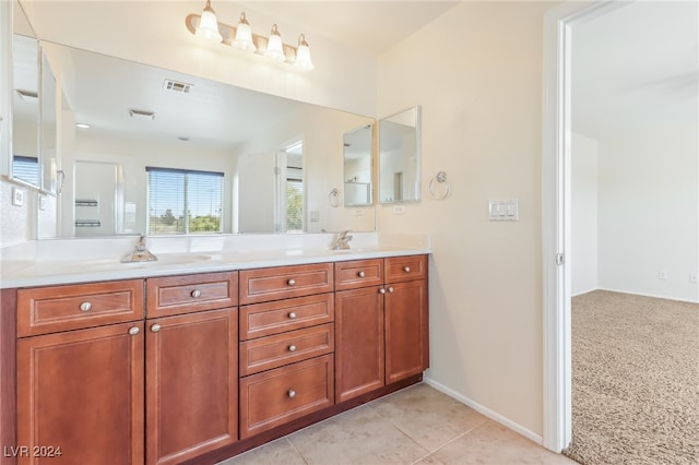 bathroom featuring tile patterned flooring and vanity