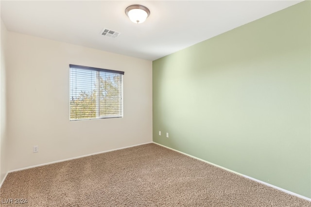 empty room with carpet flooring