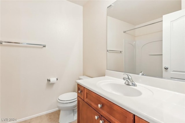 bathroom with tile patterned floors, a shower, vanity, and toilet