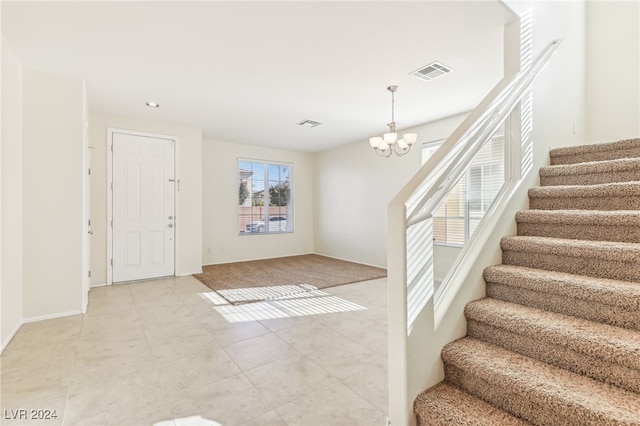 entrance foyer with a chandelier