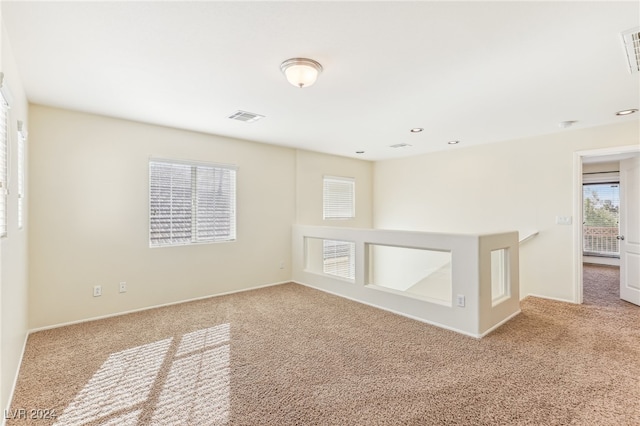 empty room featuring light carpet