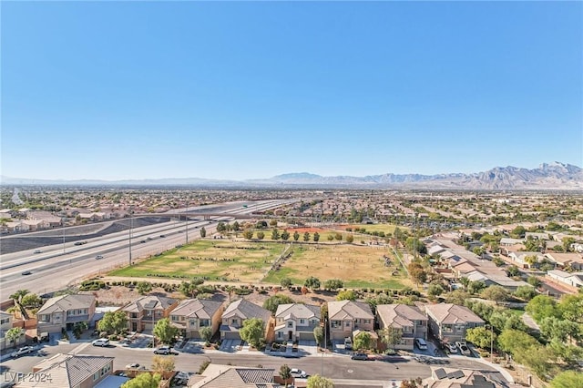 birds eye view of property with a mountain view