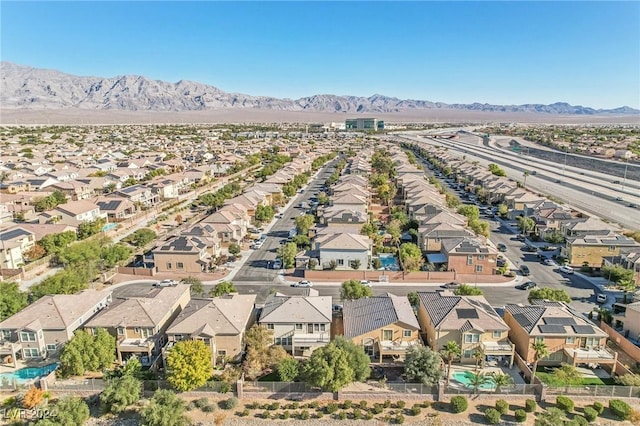 birds eye view of property featuring a mountain view