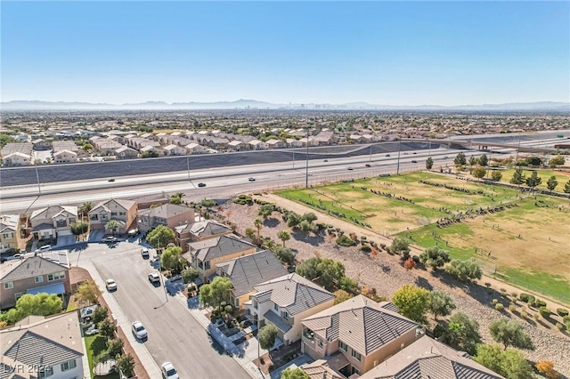 birds eye view of property with a mountain view