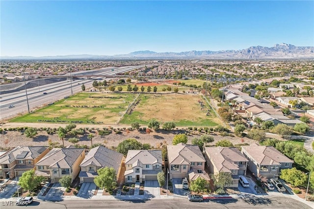 birds eye view of property featuring a mountain view