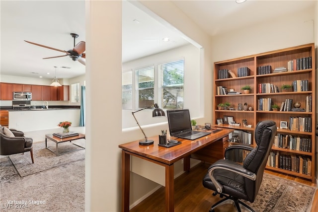 office featuring ceiling fan, hardwood / wood-style floors, and sink