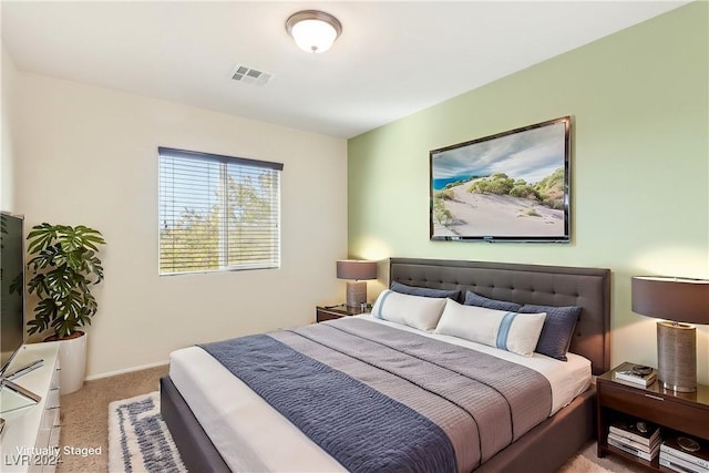 bedroom featuring light colored carpet