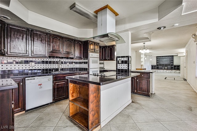 kitchen with island range hood, a kitchen island, white appliances, and decorative backsplash