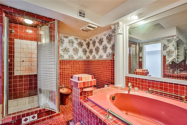 bathroom with tile walls, a bidet, shower with separate bathtub, tile patterned flooring, and decorative columns