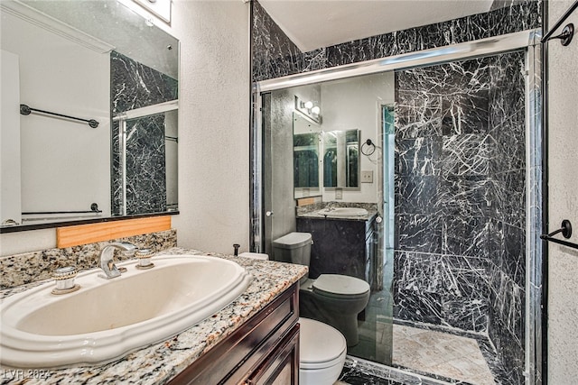 bathroom with walk in shower, vanity, a textured ceiling, and toilet