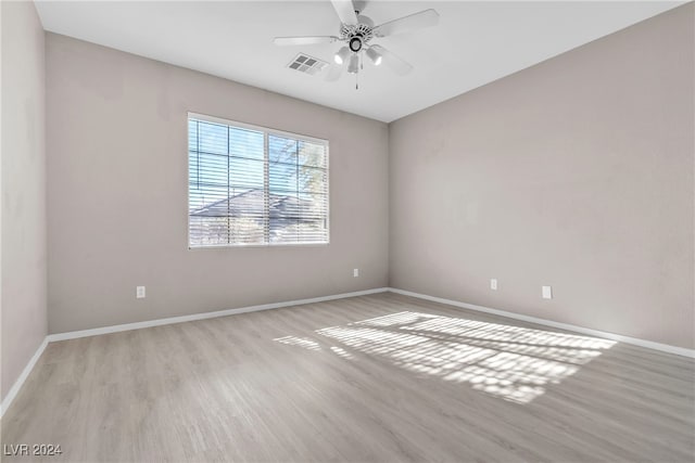 unfurnished room with light hardwood / wood-style floors and ceiling fan