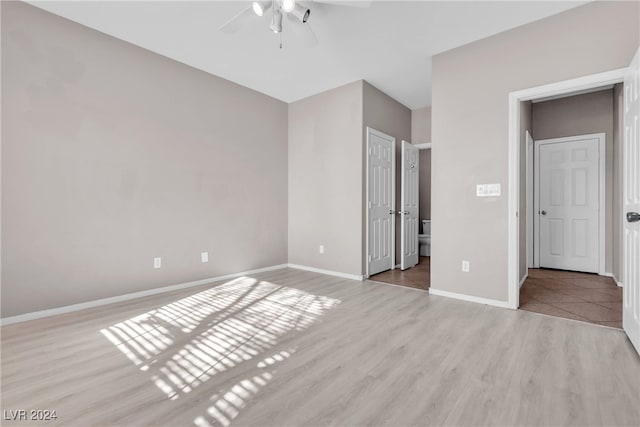 unfurnished bedroom featuring ceiling fan and light hardwood / wood-style floors