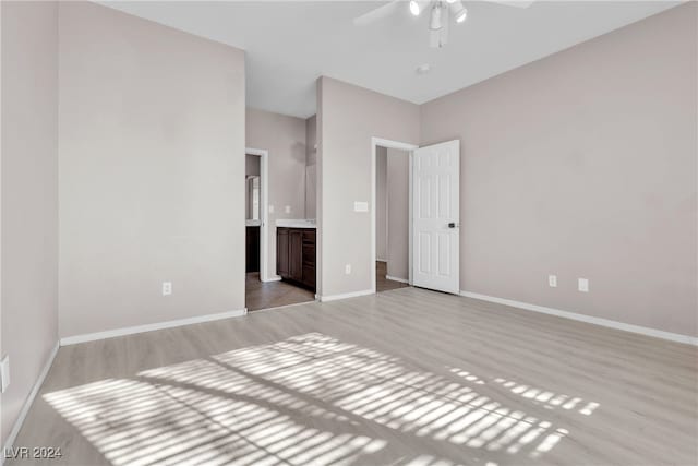 unfurnished room featuring ceiling fan and light hardwood / wood-style floors