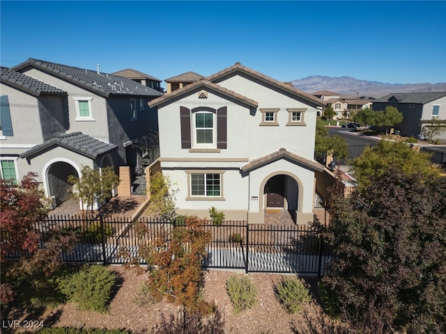 mediterranean / spanish-style home with a mountain view