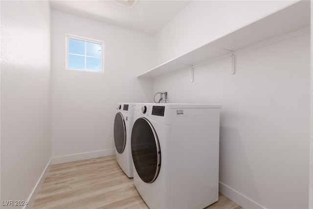 laundry room with light wood-style floors, laundry area, washer and clothes dryer, and baseboards