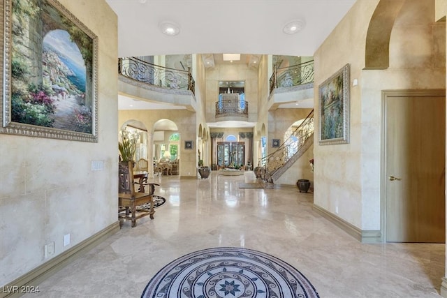 foyer with a towering ceiling