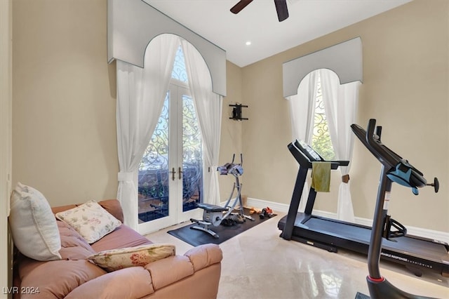 exercise room featuring ceiling fan and french doors