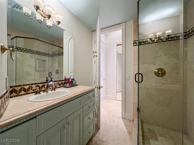 bathroom featuring vanity, tile patterned floors, and a shower with door