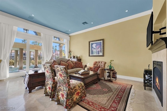 living room featuring crown molding and a high end fireplace