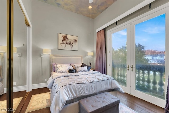 bedroom featuring french doors, access to outside, and dark hardwood / wood-style floors