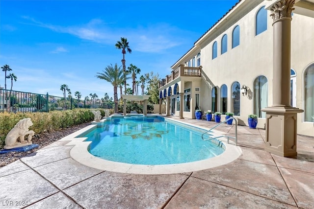 view of swimming pool featuring a patio