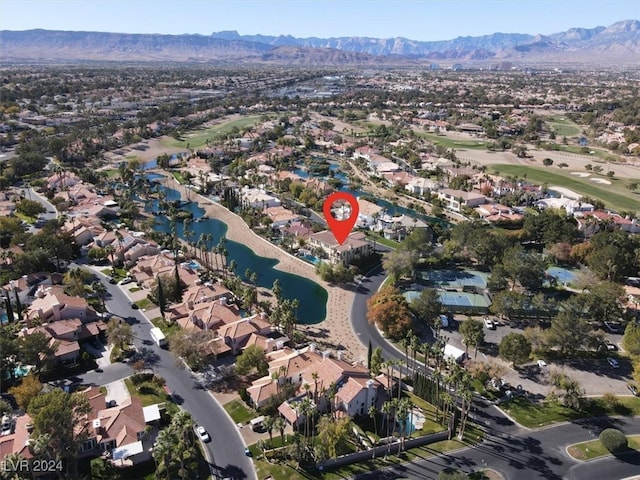 aerial view featuring a water and mountain view