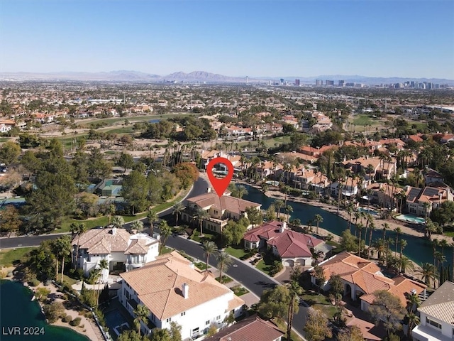 birds eye view of property featuring a water and mountain view